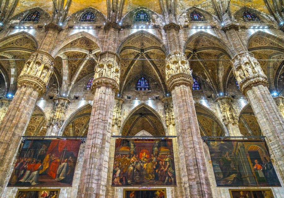 Milan: Duomo & Rooftop Tour with Optional Hop-On Hop-Off Bus - Inside the Cathedral: Gothic Detail, Paintings, Statues, and Symbol Stories