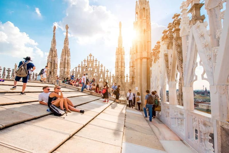 Milan: Fast Track Cathedral and Duomo Rooftop Guided Tour - Terraces first: elevator ride, city views, and those 135 spires
